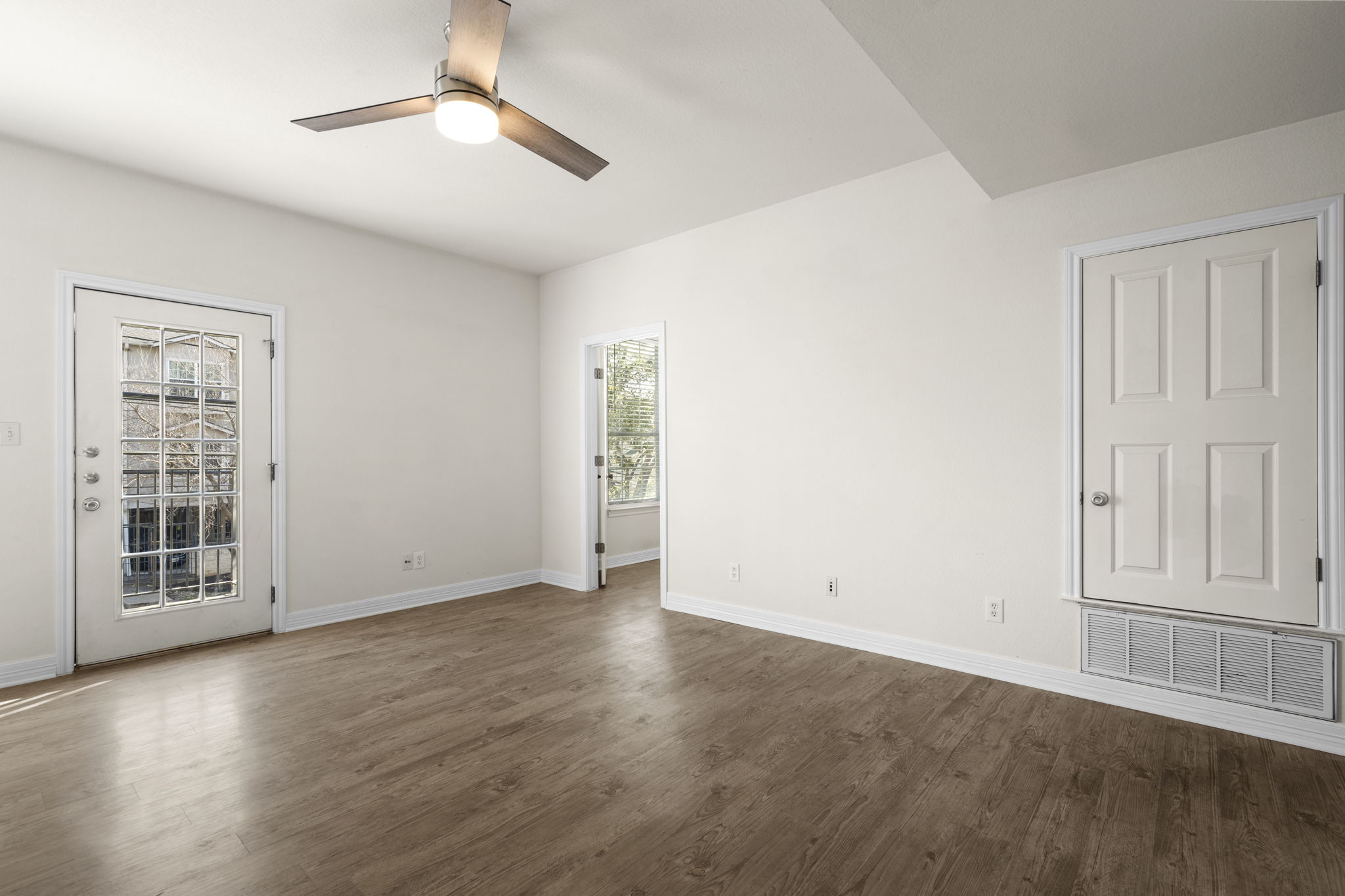 Renovated bathroom with quartz vanity and bathtub — Whitestone West Campus student apartment, Austin TX