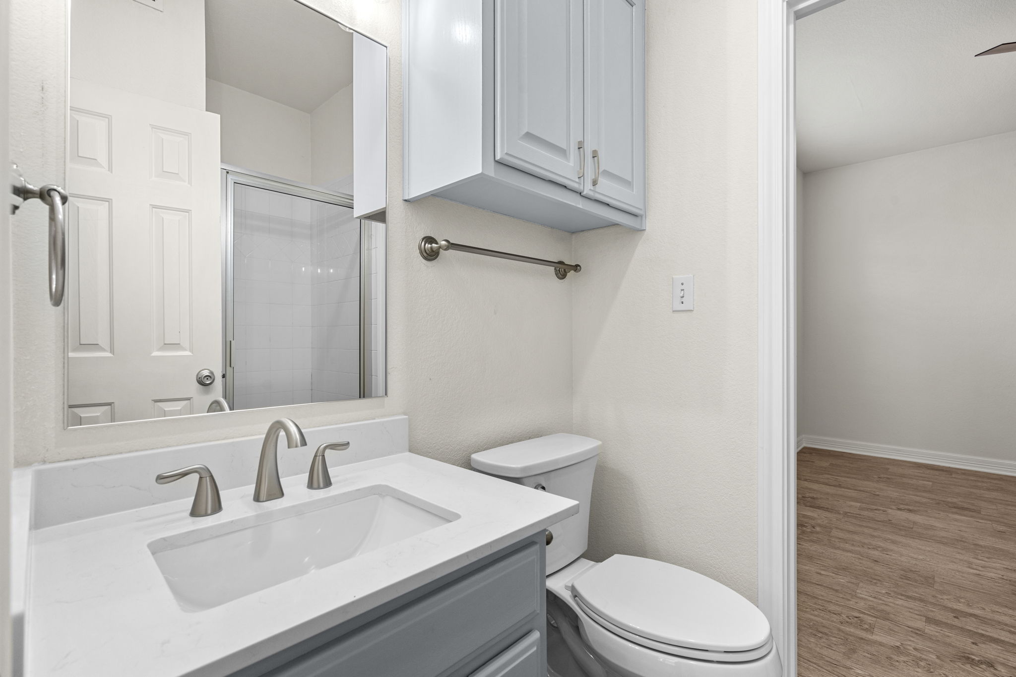 Bright private bedroom with natural light and greenery view — Whitestone West Campus off-campus student housing near UT Austin