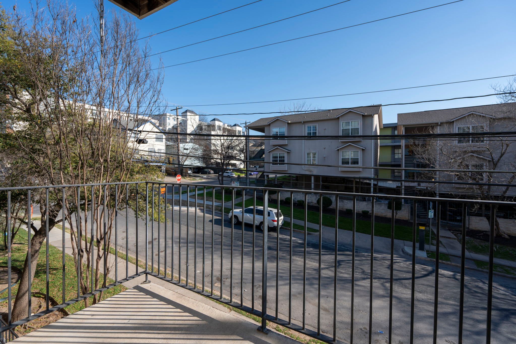 Private balcony with West Campus neighborhood view — included with every unit at Whitestone West Campus Austin TX